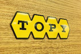 Topy Industries signboard and logo